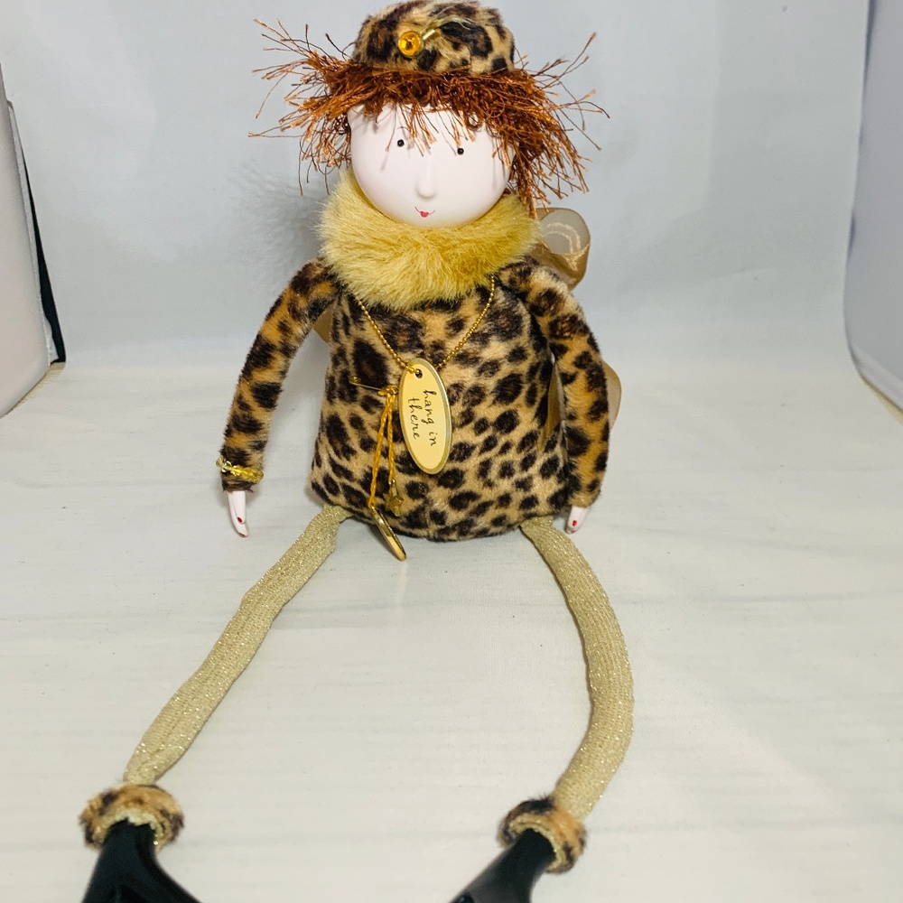Shelf‎ sitting figurine with fun accents.